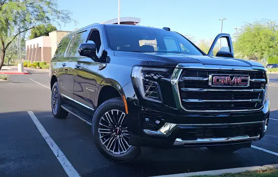 A black luxury SUV parked in a parking
